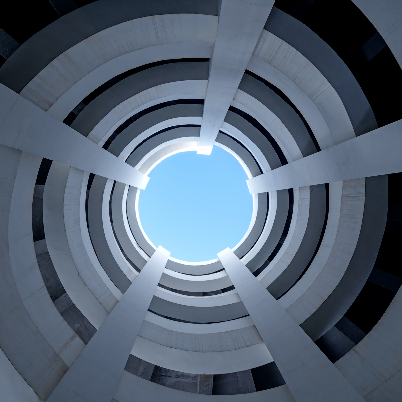 Low angle view looking up of concrete spiral parking garage