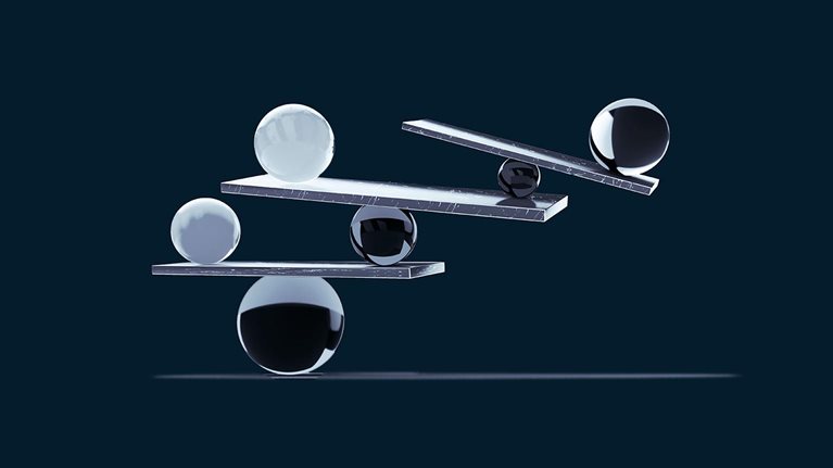 coloured glass spheres balanced on metalic beams forming a complex structure - stock photo