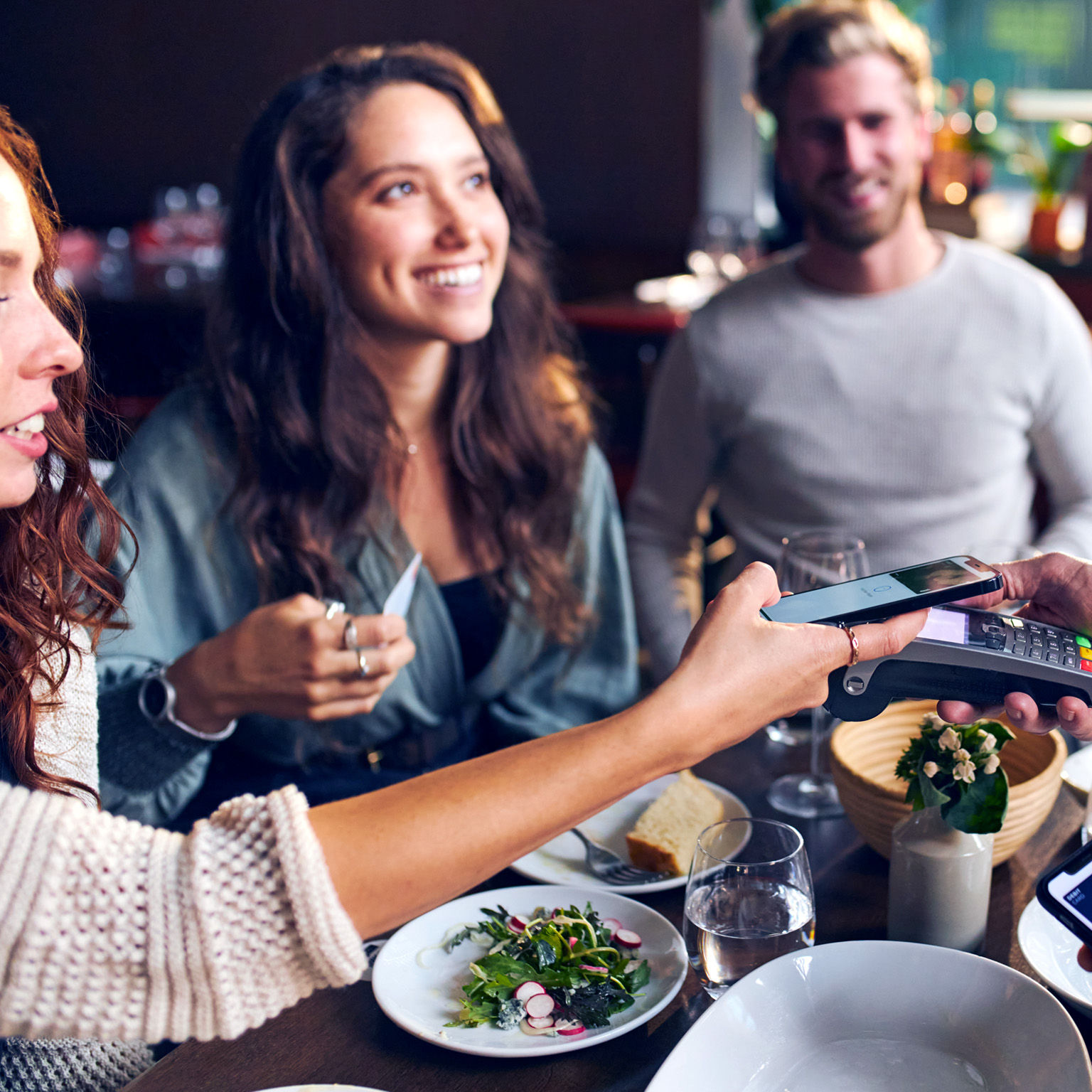 Contactless payment with friends at a restaurant