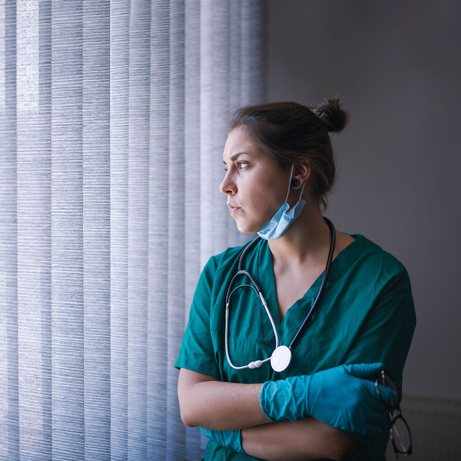 Young female healthcare person tired from the long working day
