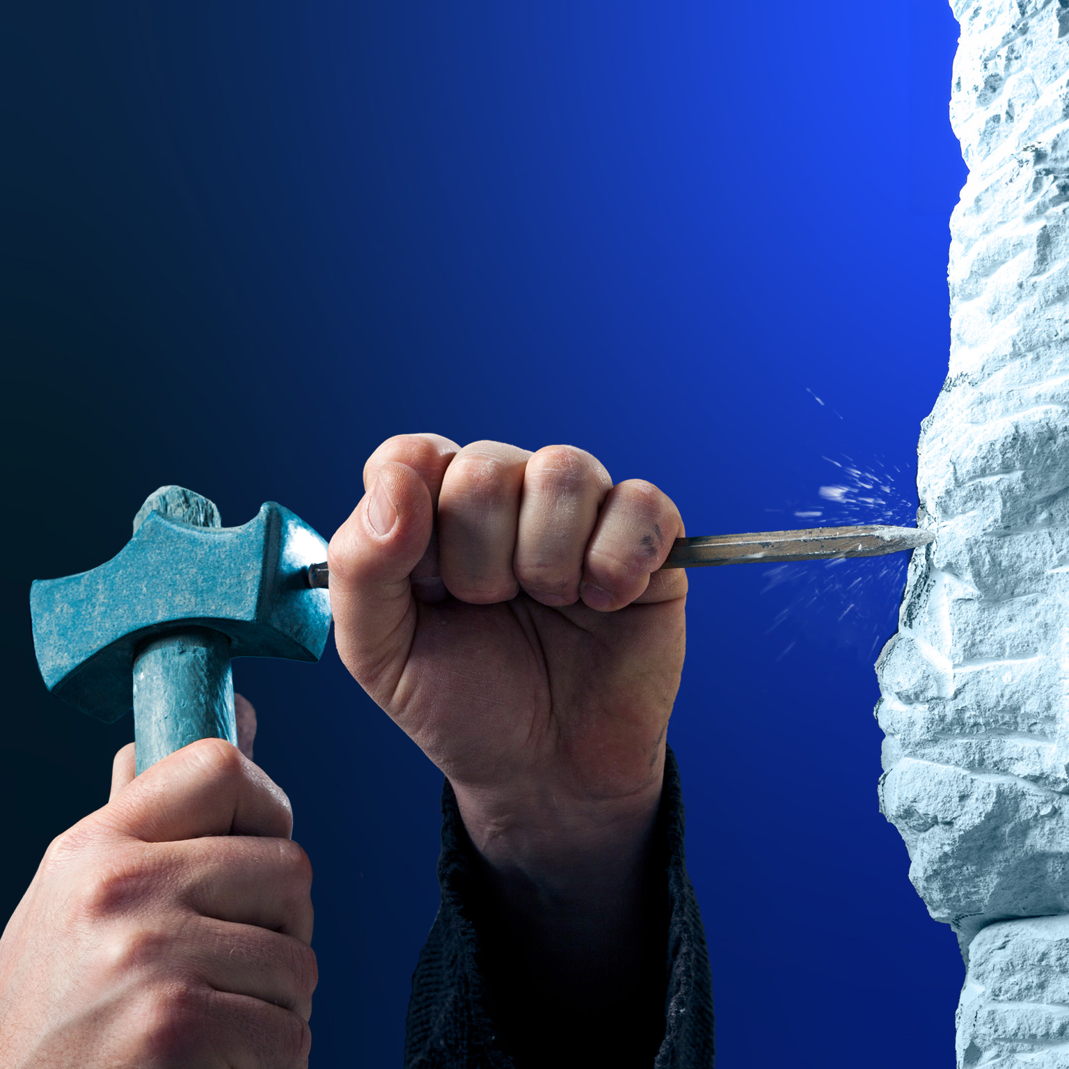 Two hands using a hammer and chisel to carve into a rough white stone surface. The close-up composition is set against a deep blue background.