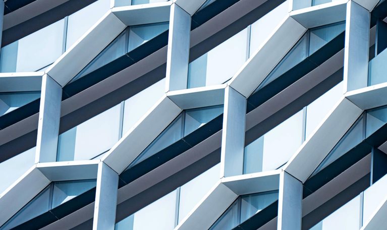 Detail of hexagon-shaped windows on a modern office building.