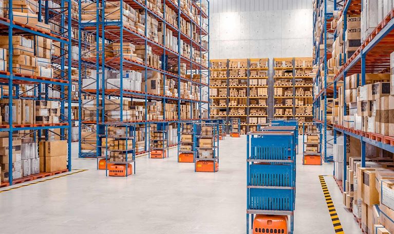 Interior of a modern warehouse where automated goods transport vehicles work. - stock photo