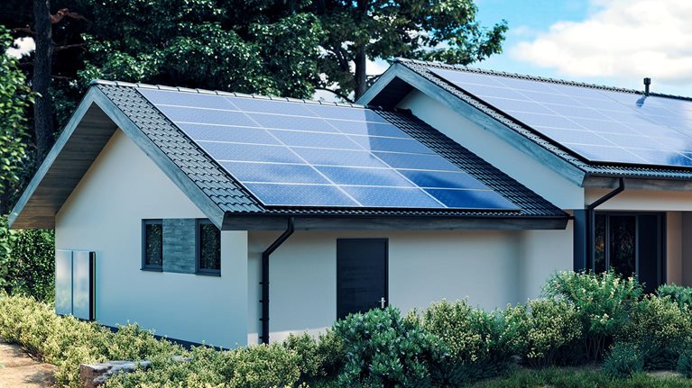 Energy efficient house with solar panels and wall battery for energy storage