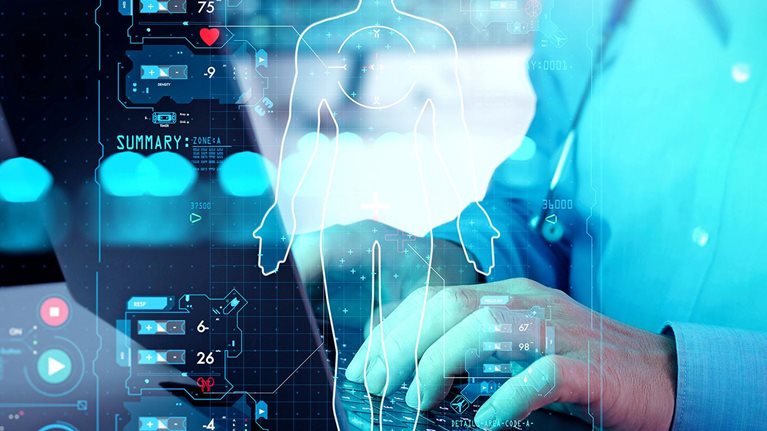 A futuristic medical interface displays a holographic human body and health metrics as a clinician works on a computer.