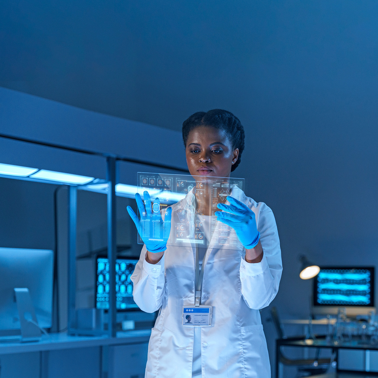 A female scientist stands in a modern lab