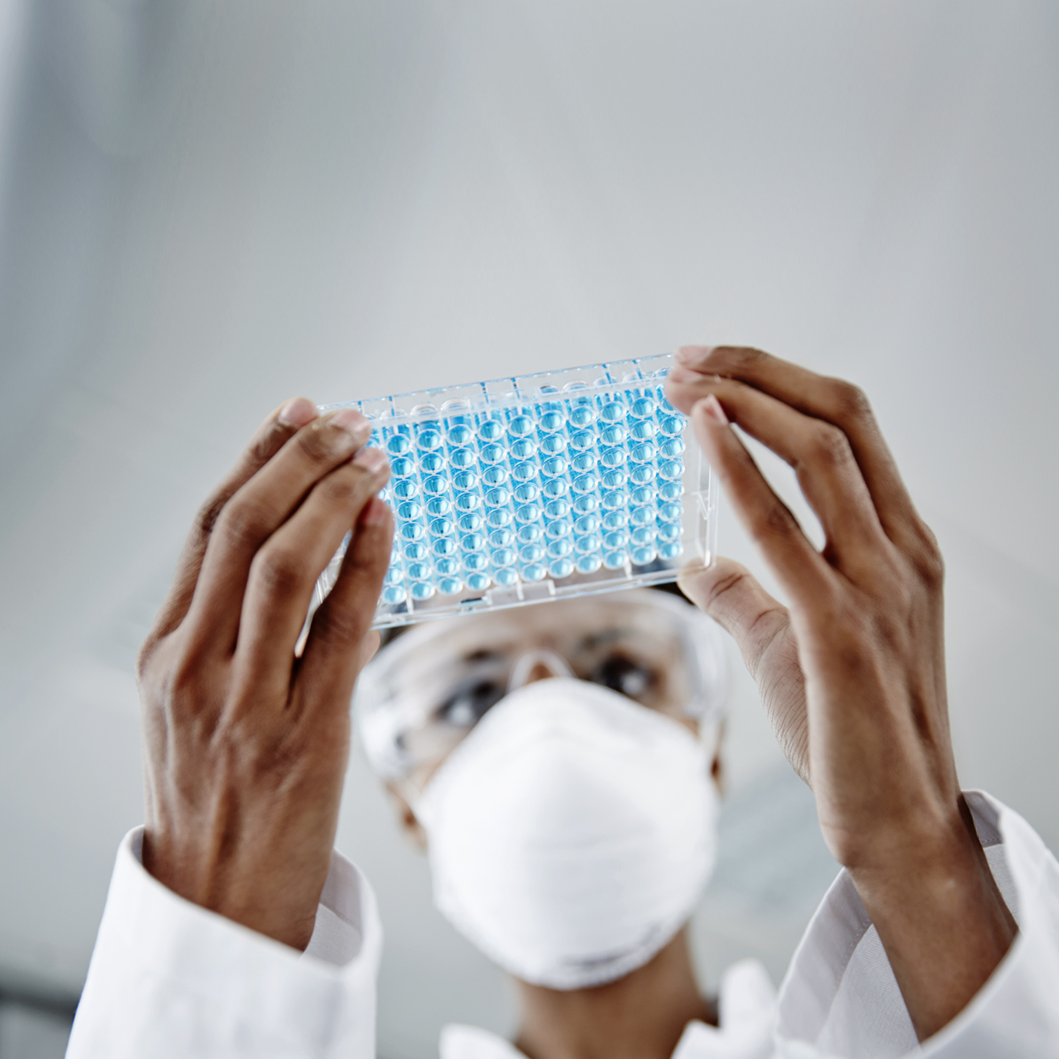 Woman examining laboratory samples