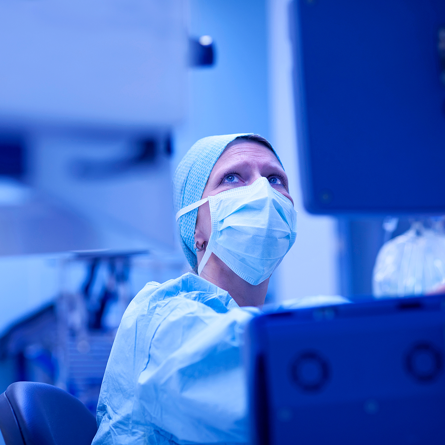  Anesthetist checking parameters gaz and bloodstream of external heart on monitor during open heart surgery.