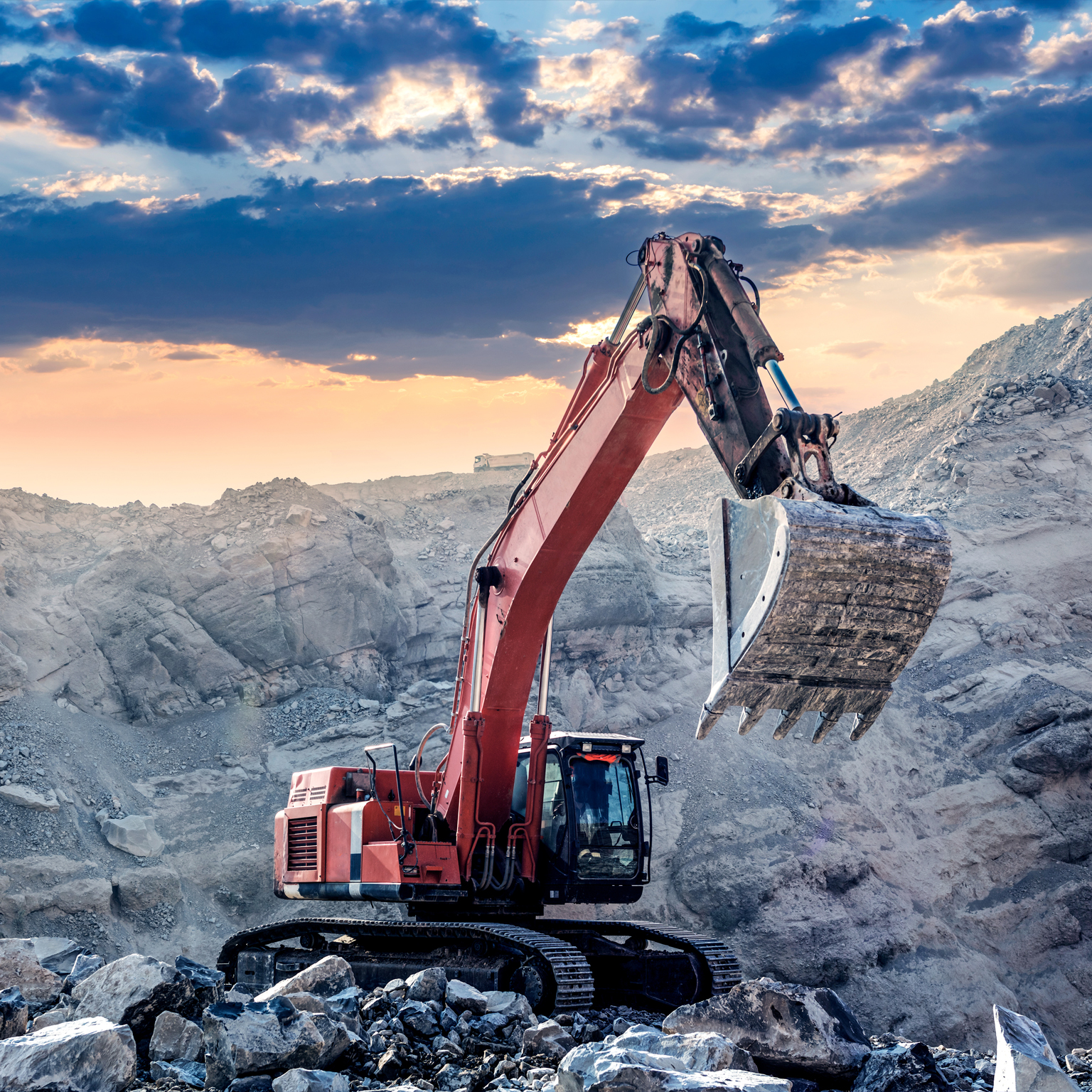 Crane digging on rocks