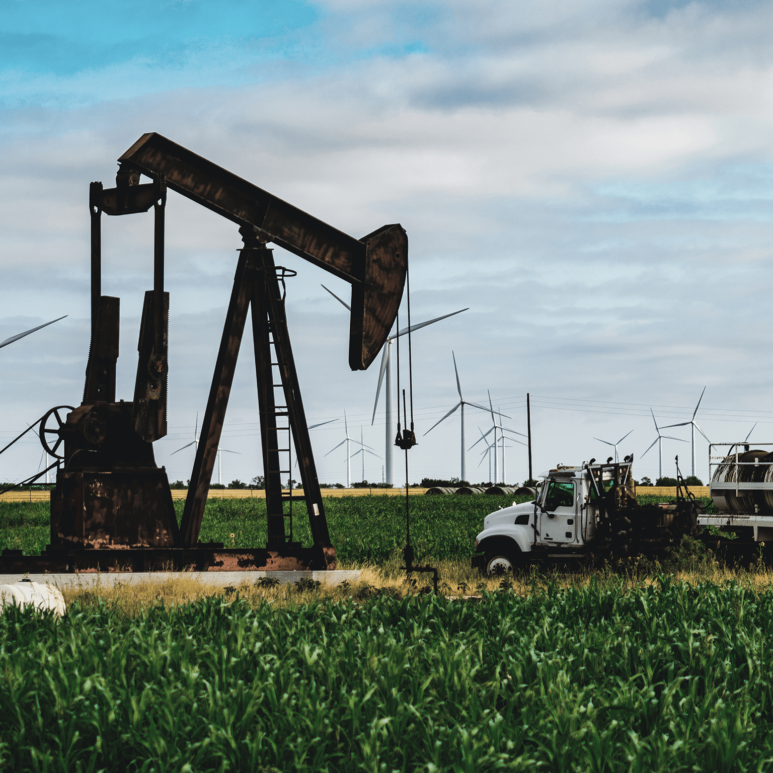 Oil rig drilling amongst crops