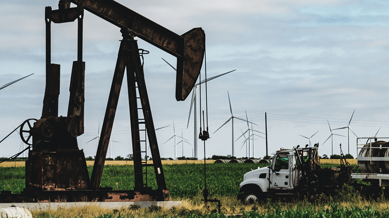 Oil rig drilling amongst crops