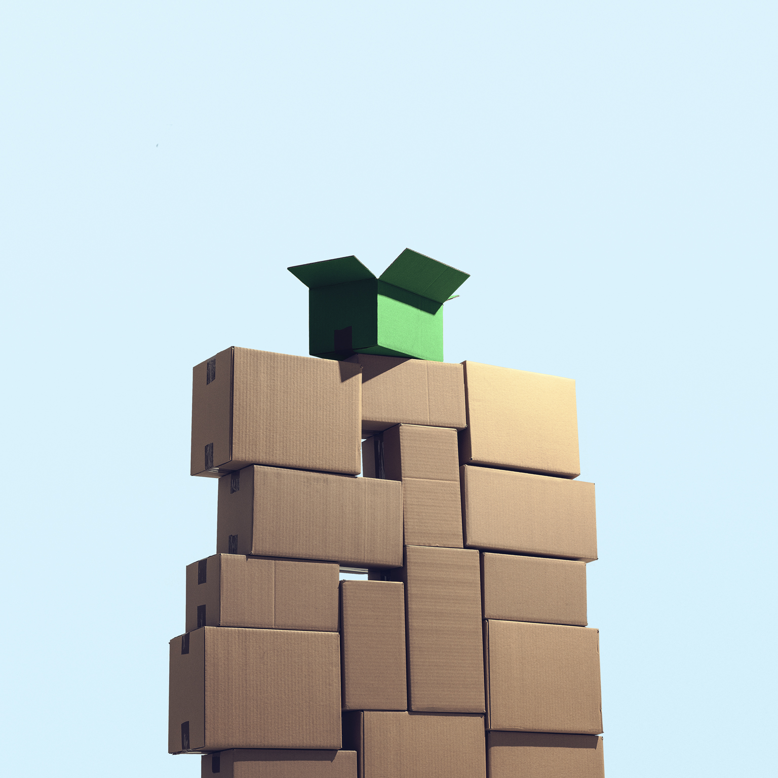 A large pile of cardboard boxes stacked on top of each other