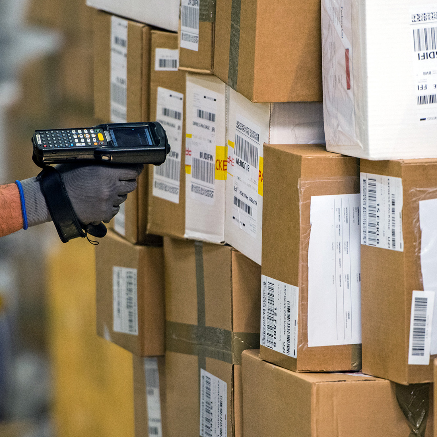 Male worker scanning barcode at warehouse