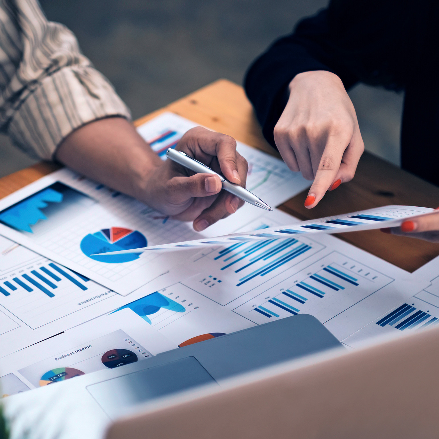 Business advisers meeting to analyze financial report in a meeting