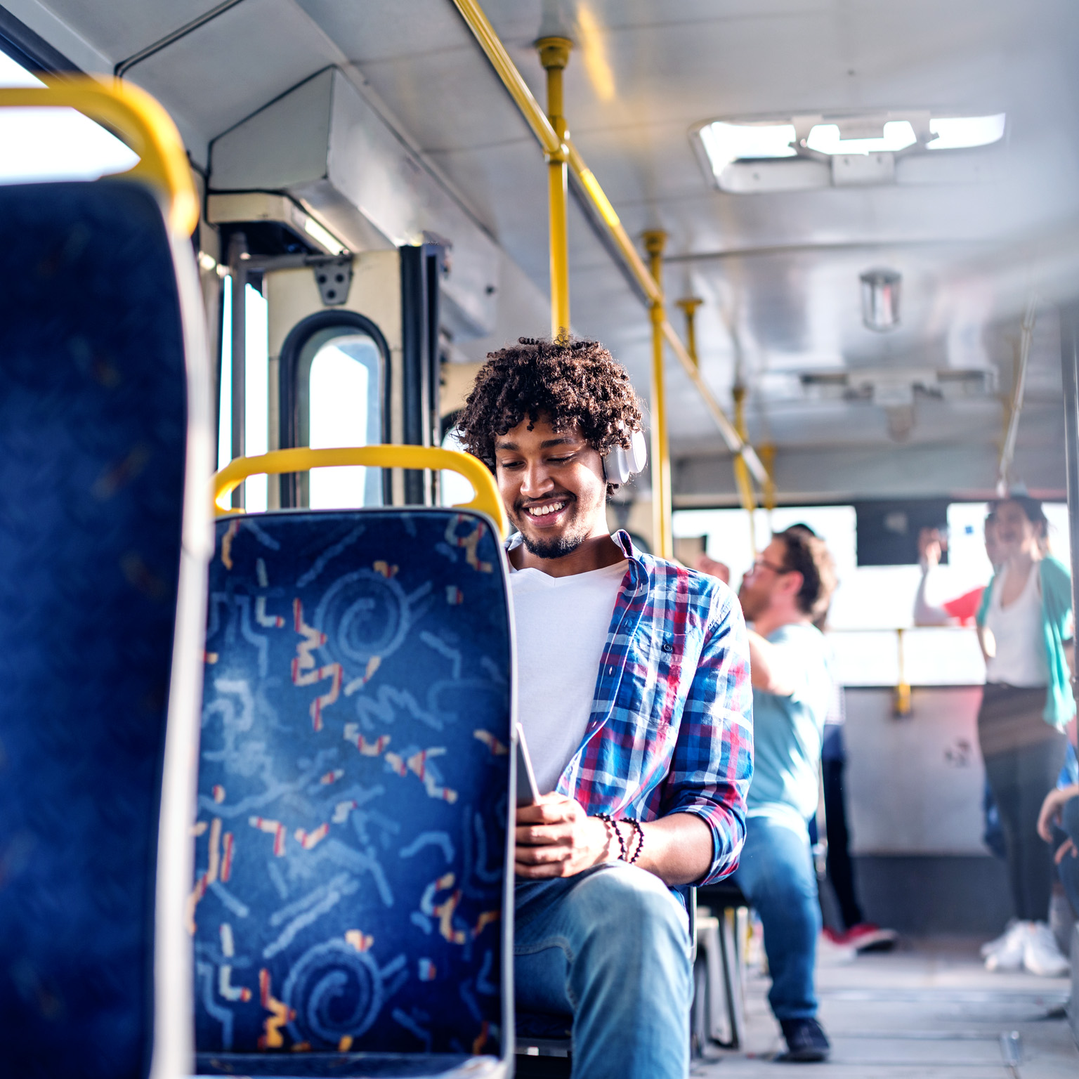 Smiling man on public transportation