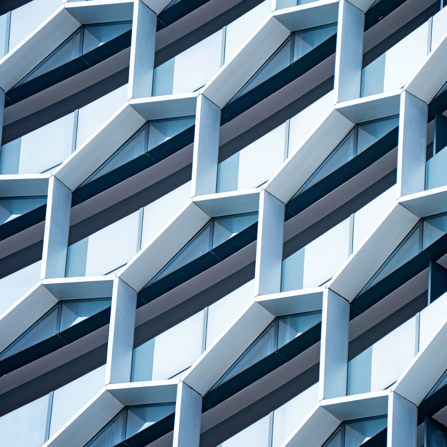 Detail of hexagon-shaped windows on a modern office building.