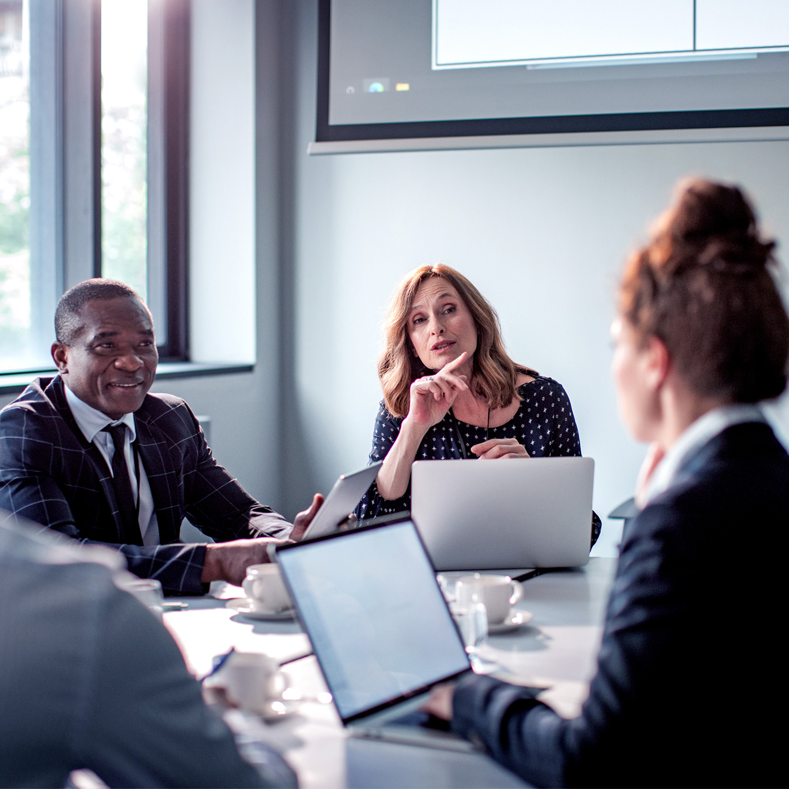 A group of business people having a meeting in a conference room