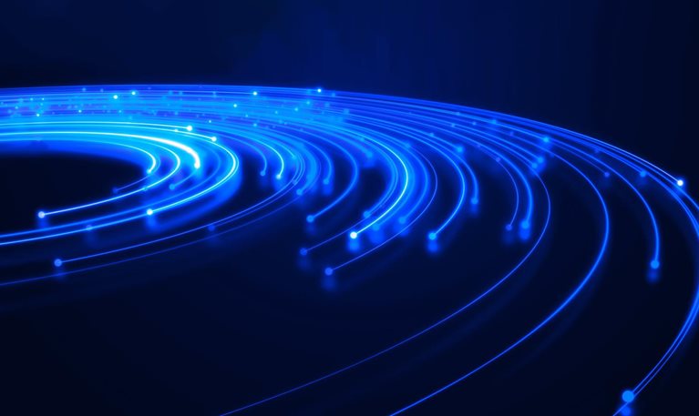 An abstract digital scene of bright blue and cyan light trails sweeping in curved paths across a dark navy background.