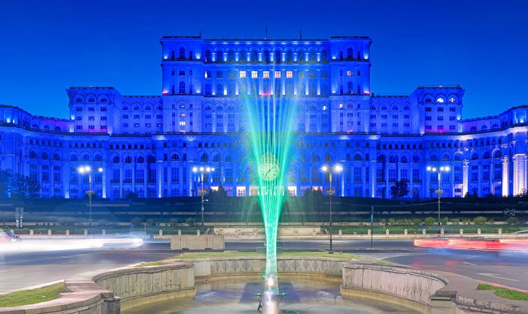 Sunset at the Palace of the Parliament in Bucharest, Romania bathed in blue light