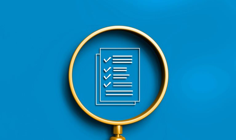 A gold magnifying glass with a checklist inside its lens, all against a solid blue background.