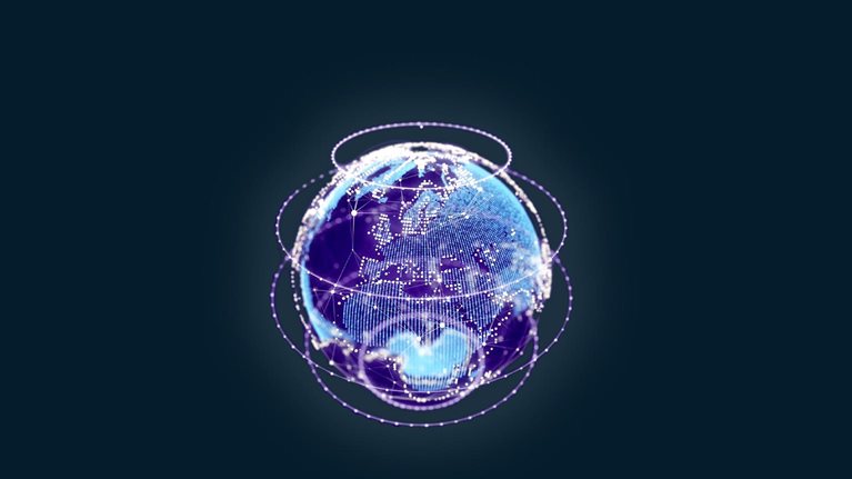 A globe composed of blue dots and lines that rotate, giving the impression of changing data. It is encircled by multiple spinning rings of light and is placed against a dark blue backdrop.