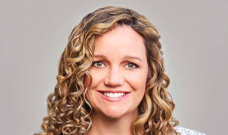 Smiling portrait photo of Laura Hines-Pierce, co-CEO of Hines