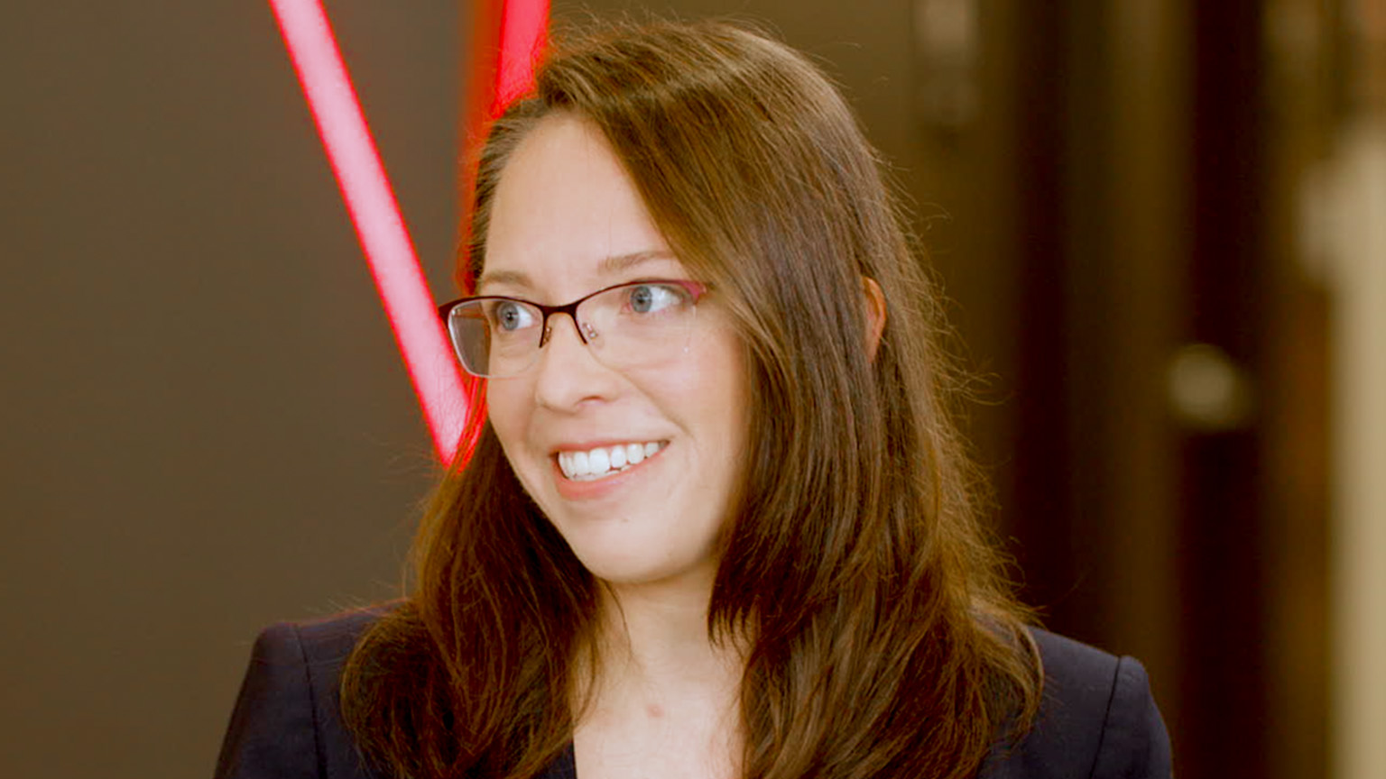 A still image of Ashley Fenn being interviewed.