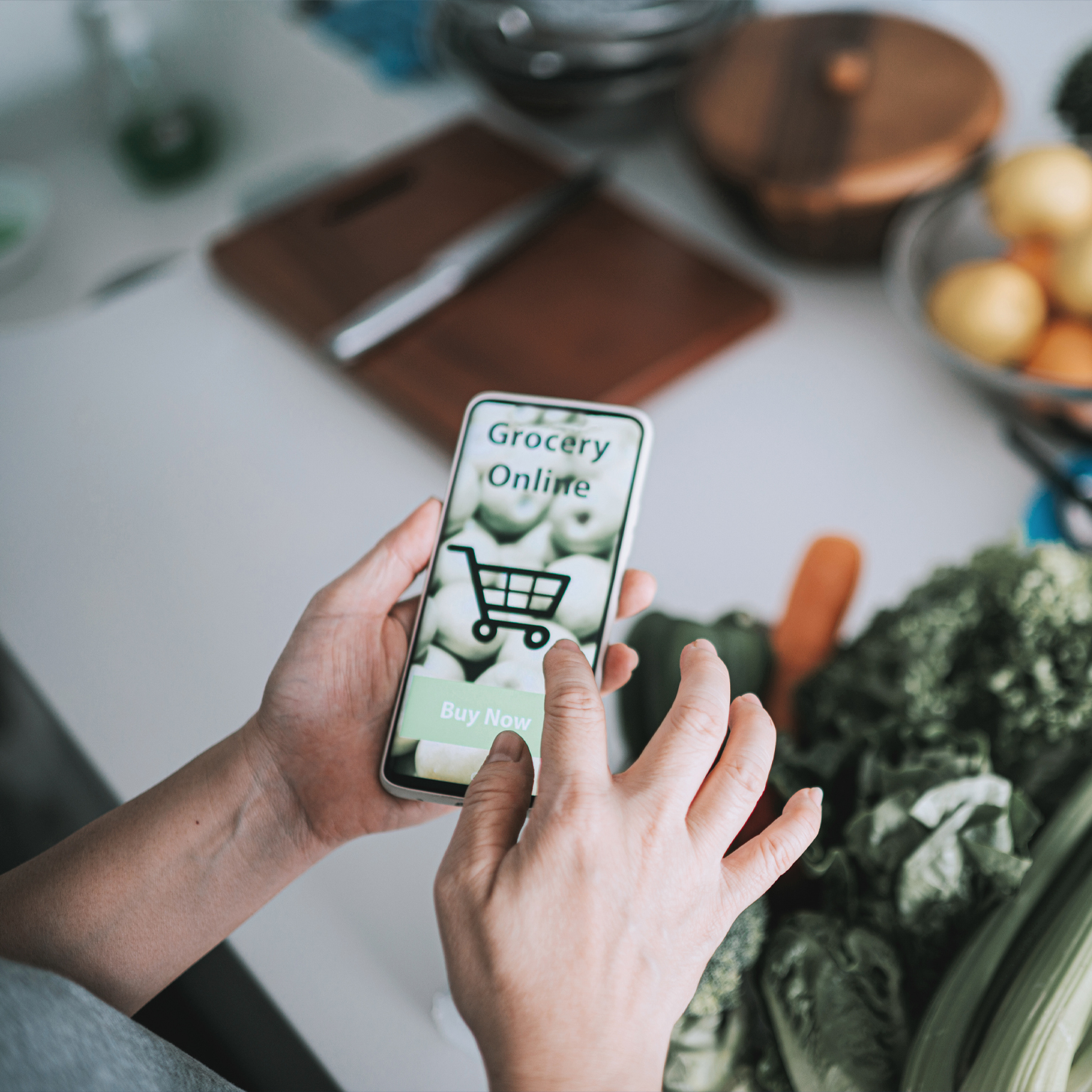 Person doing online shopping at kitchen counter