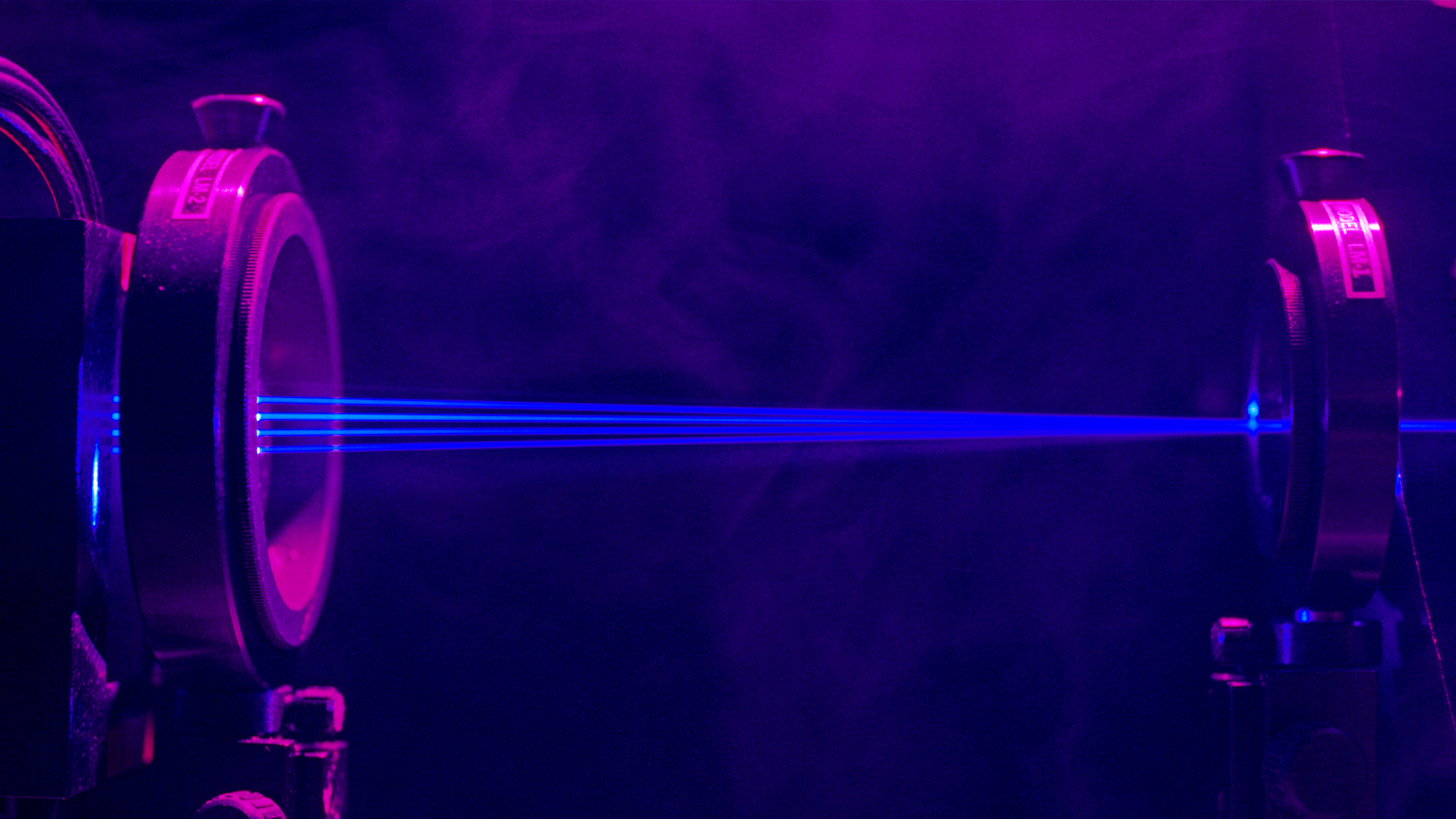 Rays of blue light passing through instruments