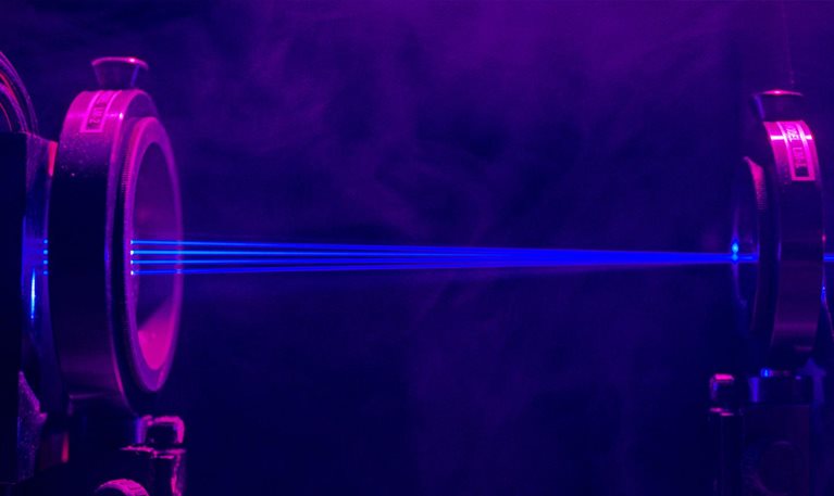 Rays of blue light passing through instruments