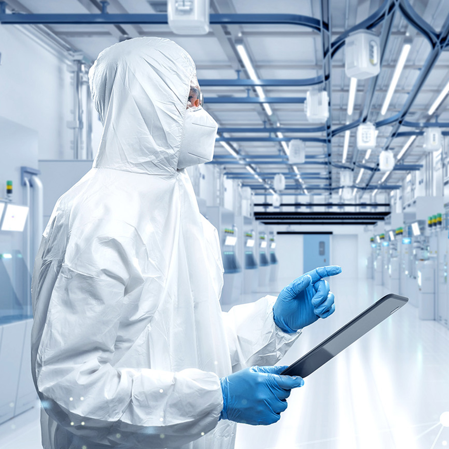 Worker or engineer wears protective suit or coverall suit work in semiconductor manufacturing factory.