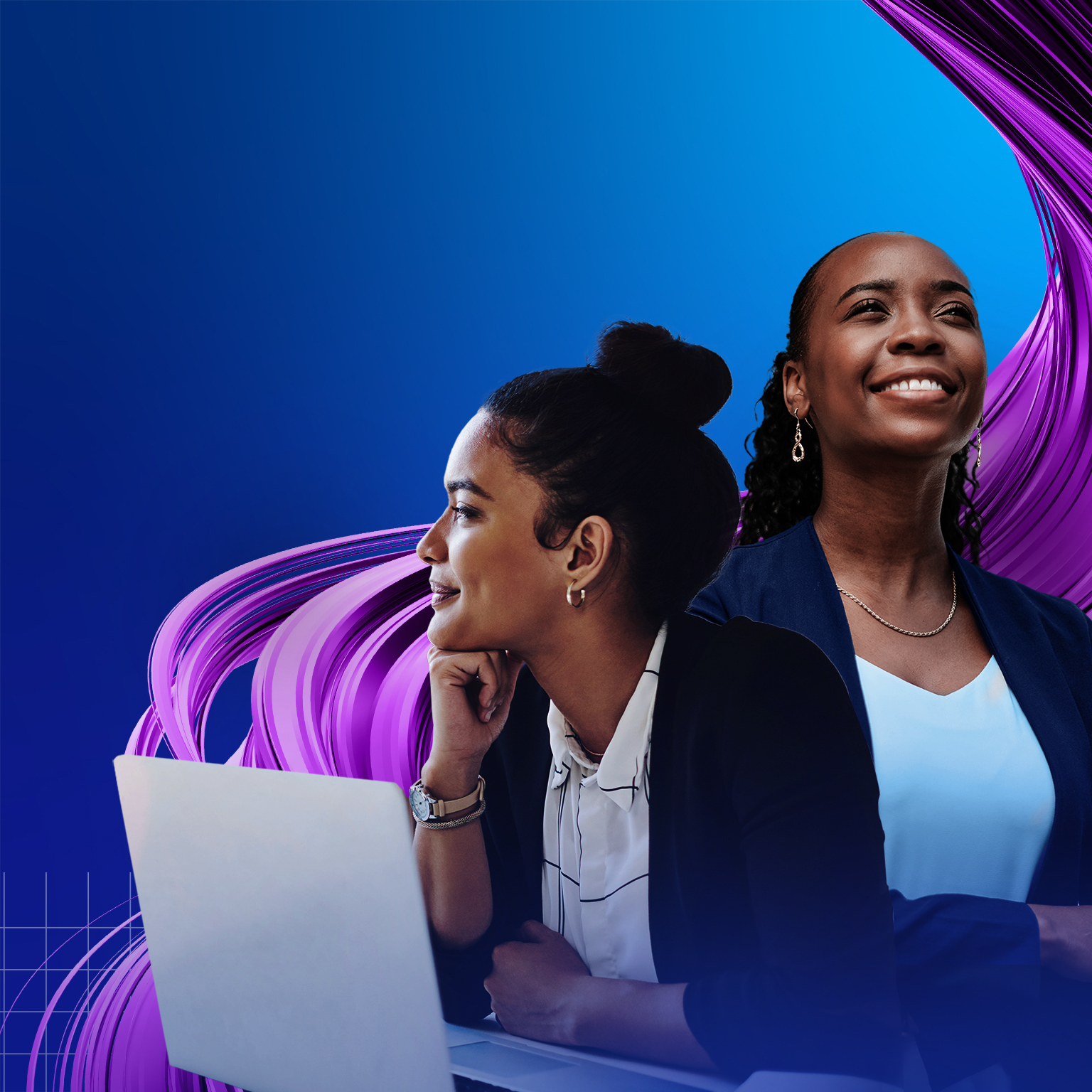 Two women working together on a laptop.