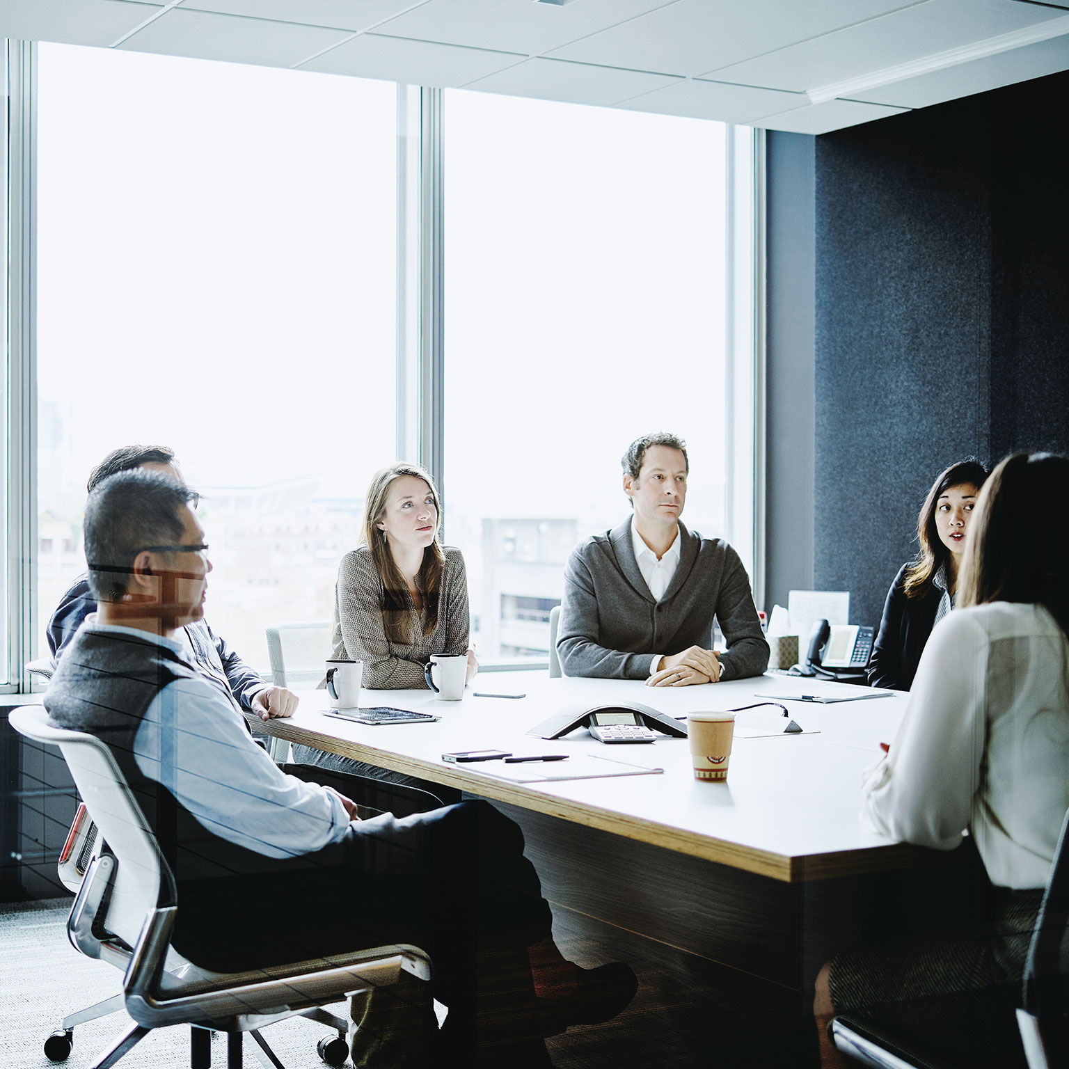 Coworkers in morning meeting in conference room