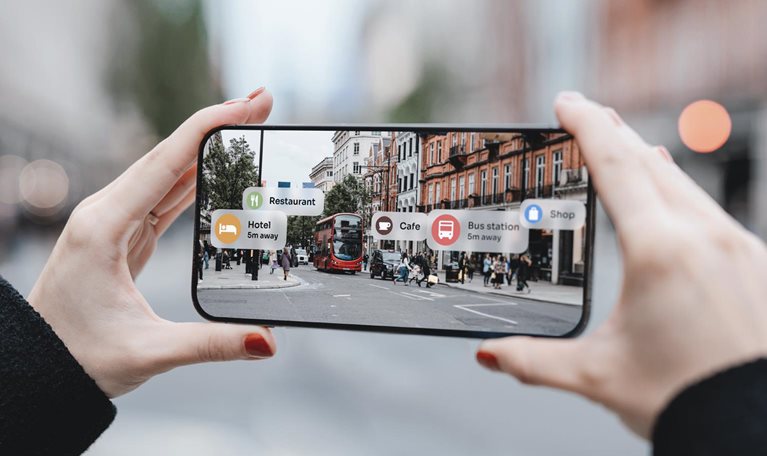 Young woman locating direction with augmented reality technology on smartphone on street.