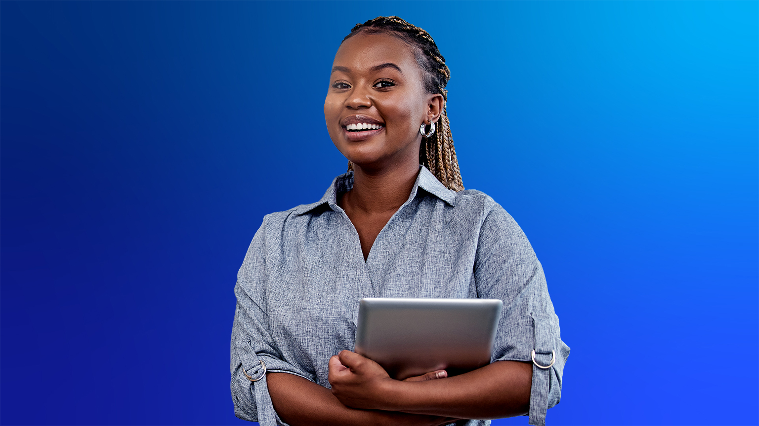 Cheerful black lady holding a laptop