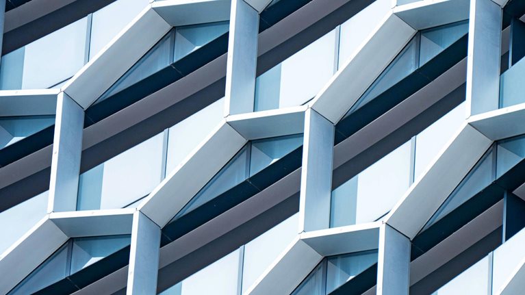 Detail of hexagon - shaped windows on a modern office building.