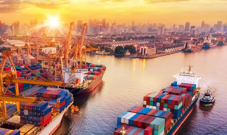 Logistics and transportation of Container Cargo ship and Cargo plane with working crane bridge in shipyard at sunrise