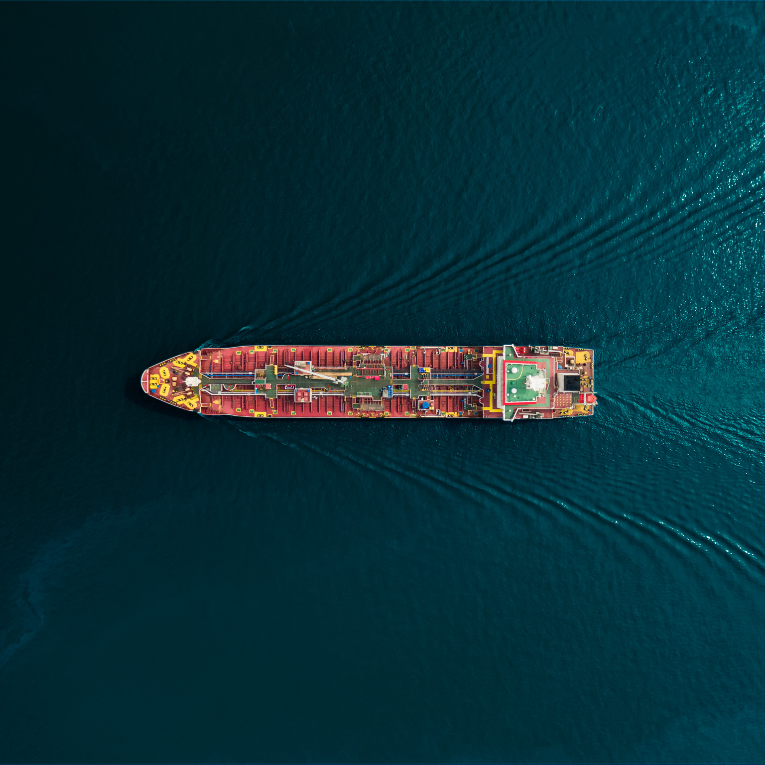 Aerial top view oil ship tanker carrier oil from refinery for transportation on the sea. - stock photo