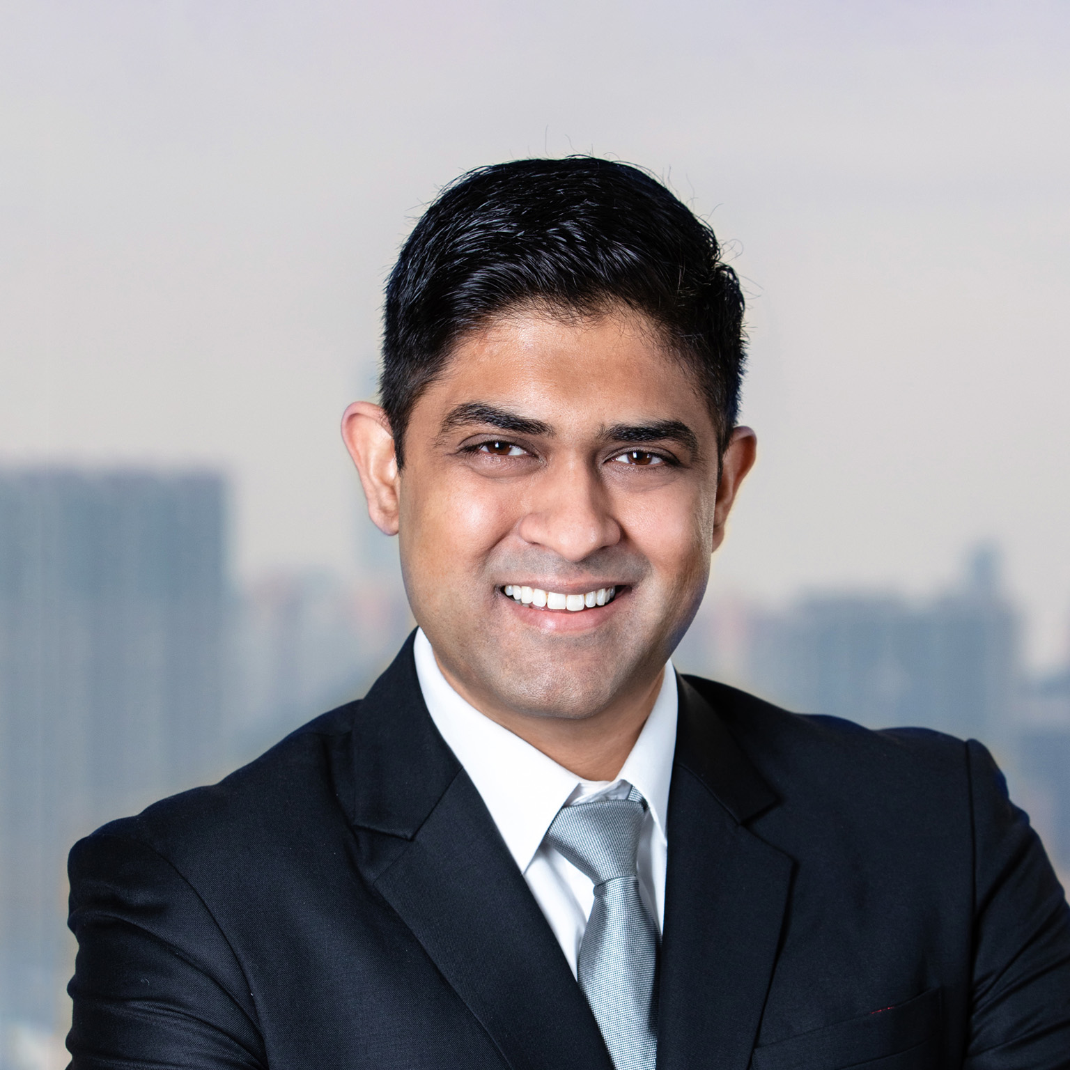 A smiling portrait of Akhil Nair