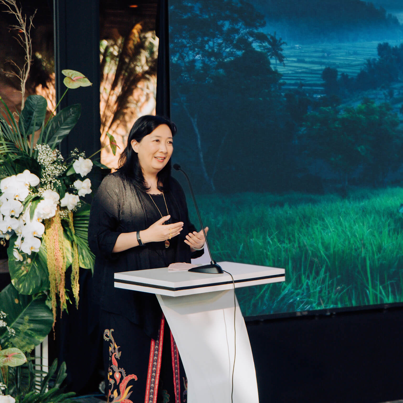 Phillia Wibowo speaking at podium