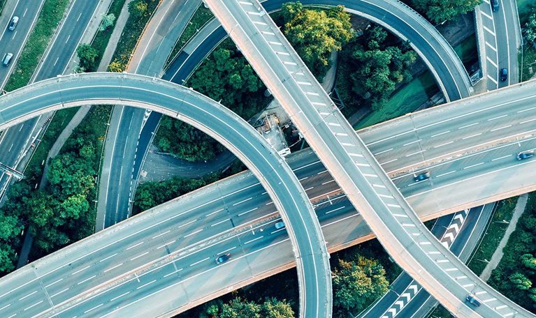 An aerial daytime view of a UK motorway intersection