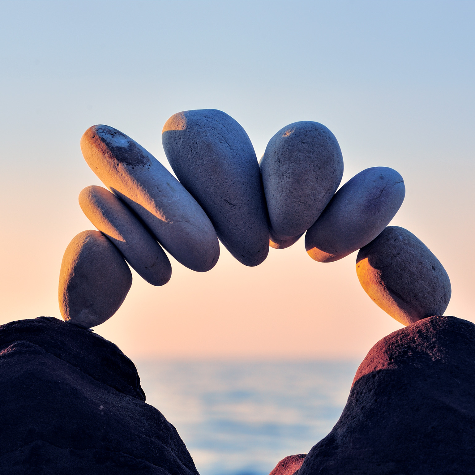 An arc of pebbles along the coast