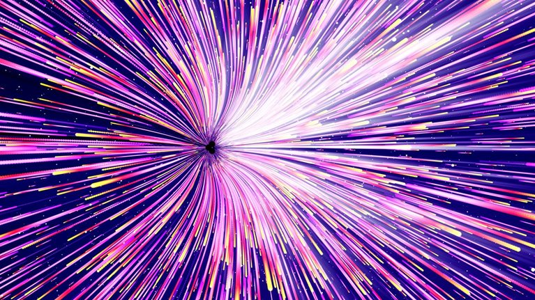 Multicolored light trails moving at high speed and radiating out from a single point.