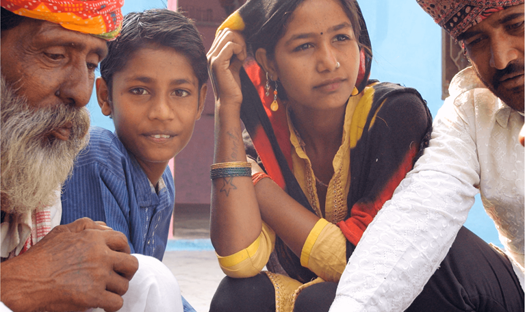 Image showing people from various ages gathered around as part of a community to illustrate how six years of higher quality life for everyone is within reach in the report titled “Adding years to life and life to years"