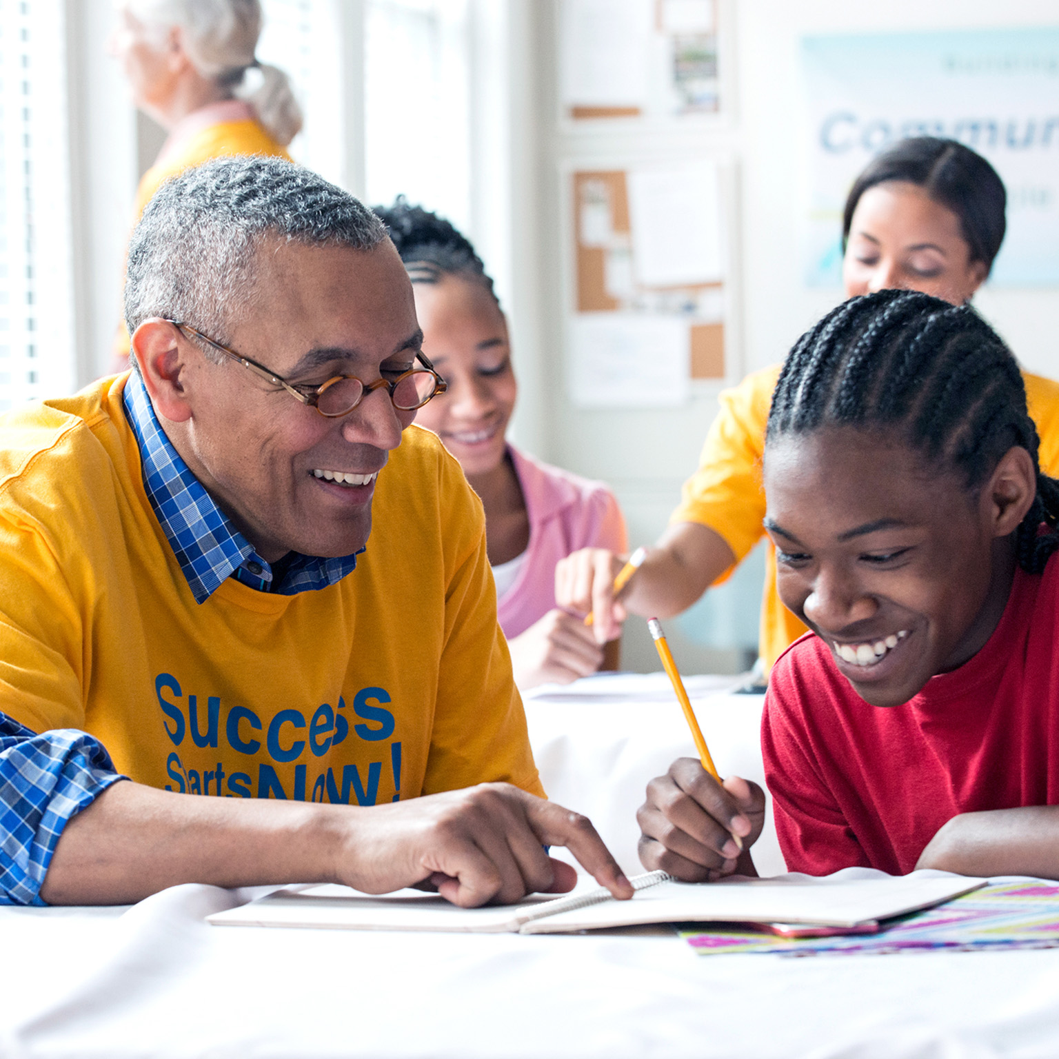 Senior Volunteers tutoring students in classroom