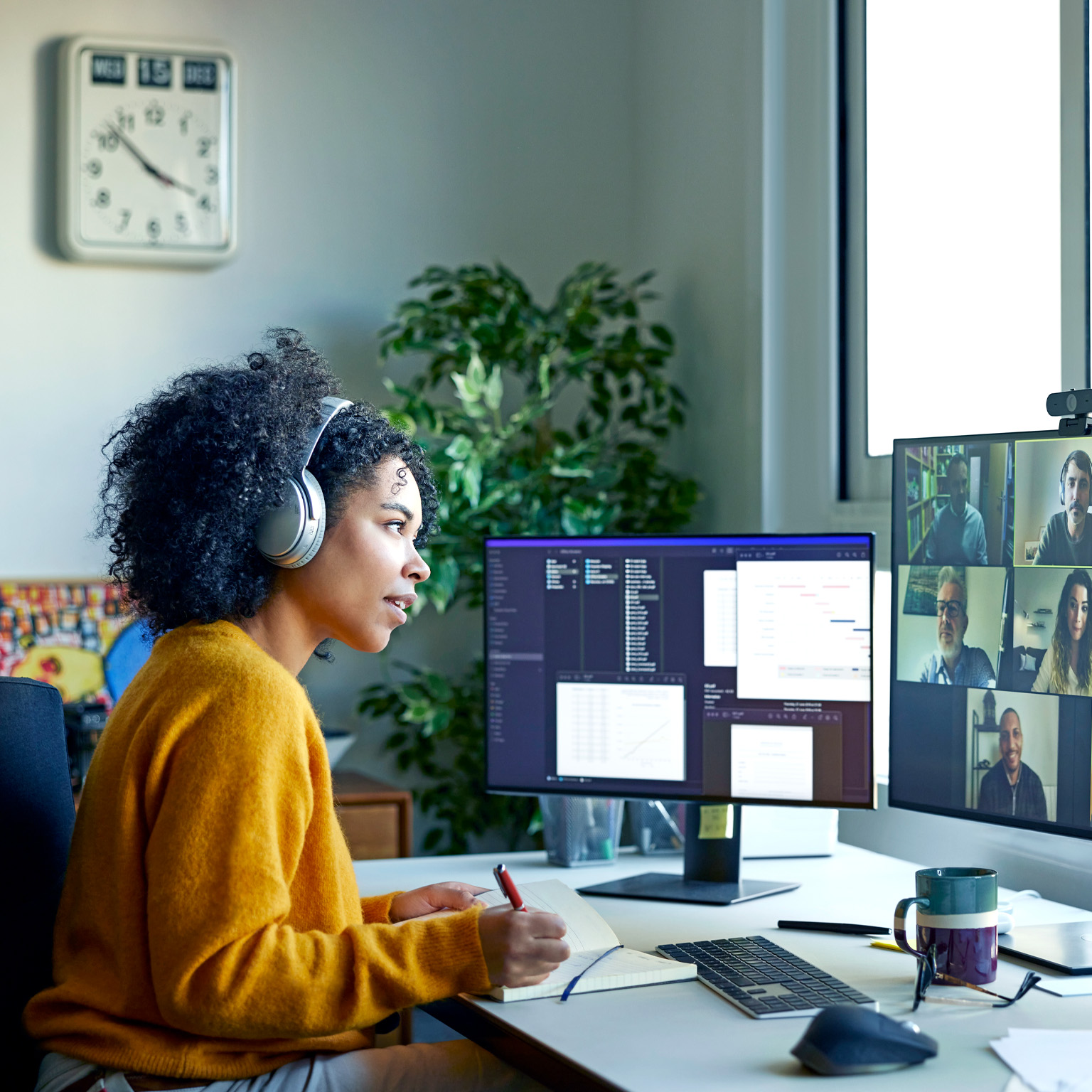 Businesswoman with headphones on a video conference