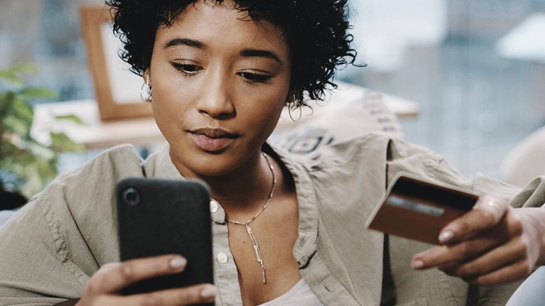 Woman reviewing financing on smart phone